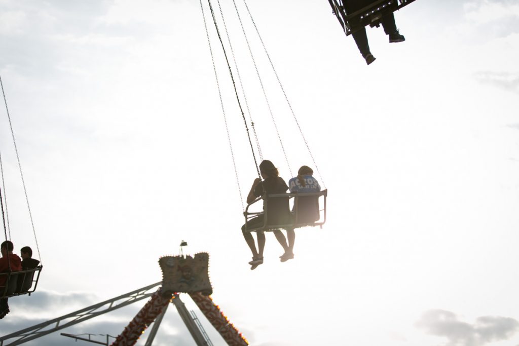 Amusement park rides at the county fair, by NYC photojournalist, Kelly Williams