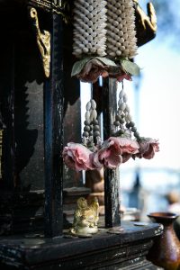 An outside altar at the Wat Mongkolratanaram, photographed by NYC photojournalist, Kelly Williams