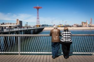 People on the boardwalk on Coney Island opening day 2017