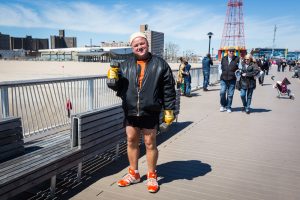 Strong man on the boardwalk on Coney Island opening day 2017