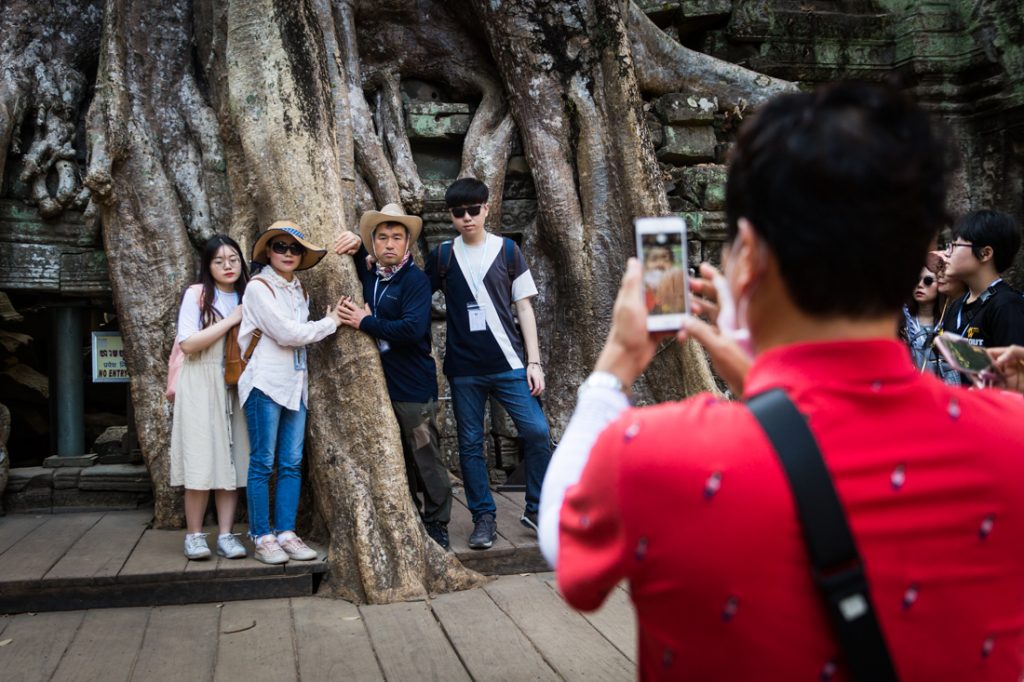 Tourists at Ta Prohm for an Angkor Wat temple guide