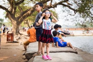 Little girl wearing sunglasses for an article on Angkor Wat travel tips