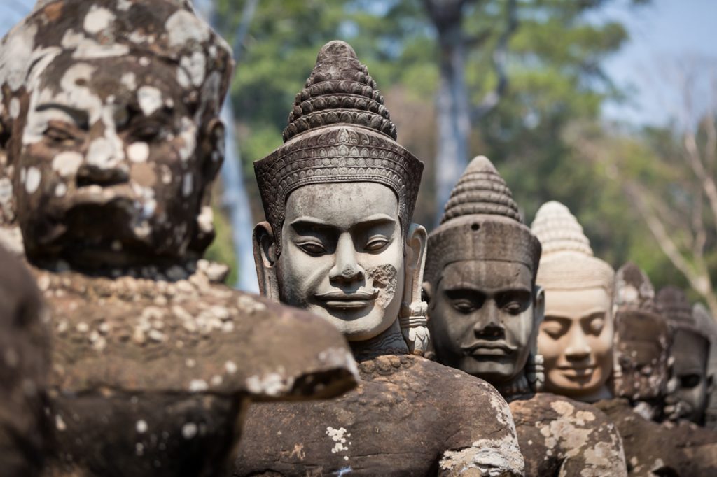 Line of statue heads at Bayon Temple for an article on Angkor Wat travel tips
