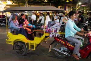 Family in a tuk tuk for an article on Siem Reap travel tips