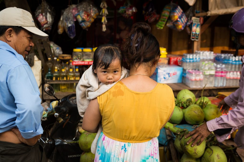 Baby on mother's shoulder for an article on Siem Reap travel tips
