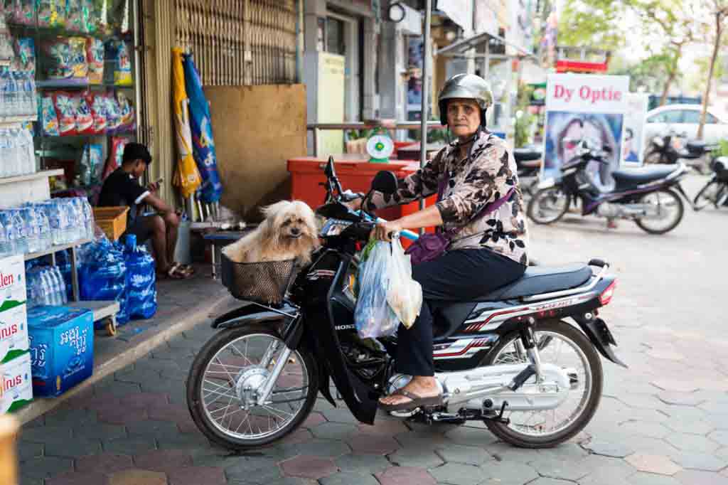 Woman on motor bike for an article on Siem Reap travel tips