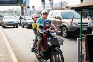 Family on a motor bike for an article on Siem Reap travel tips