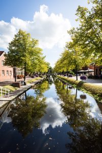 Canal with reflection of trees in Papenburg, Germany