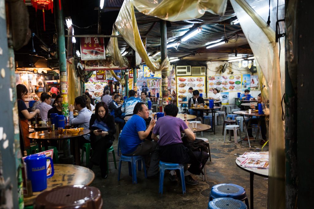 People eating in a Hong Kong restaurant for a Hong Kong travel guide article