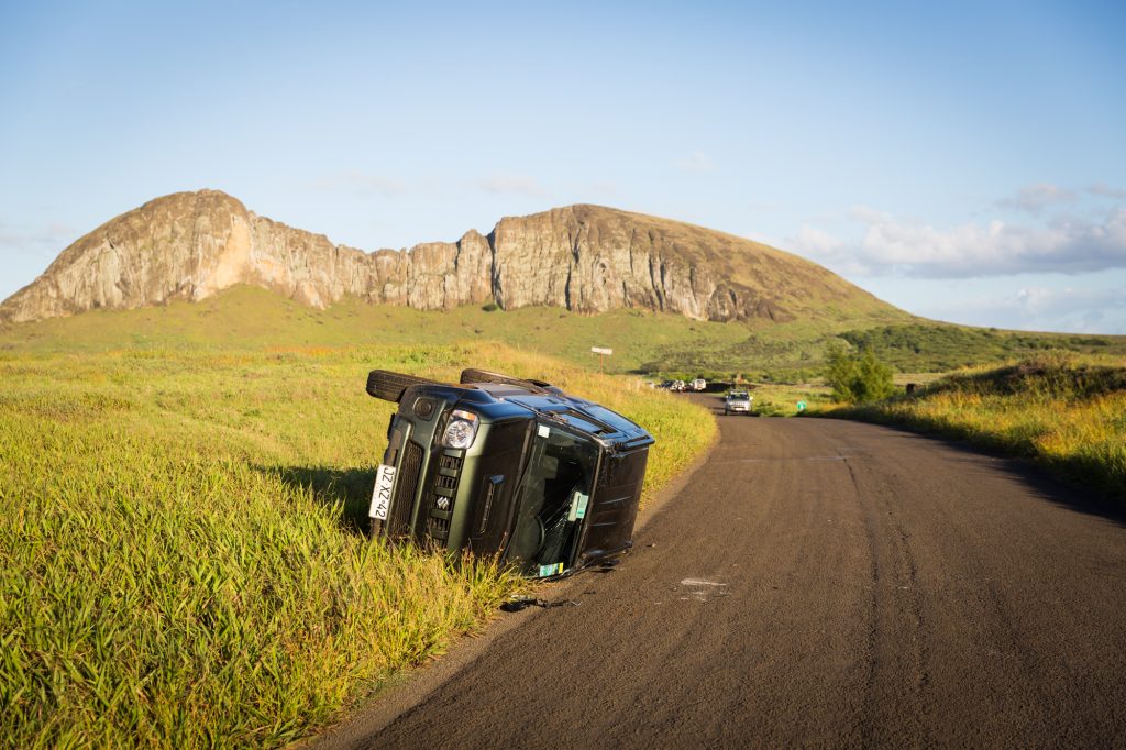 Flipped over car for an Easter Island travel guide