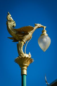An ornate lamppost at the Wat Mongkolratanaram, photographed by NYC photojournalist, Kelly Williams