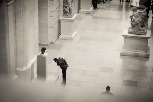 Candid shot of a museum goer at the Metropolitan Museum of Art, by NYC street photographer, Kelly Williams