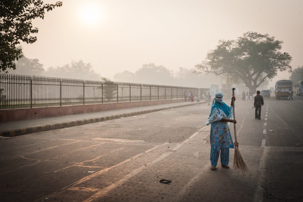 Street sweeper in Delhi, India