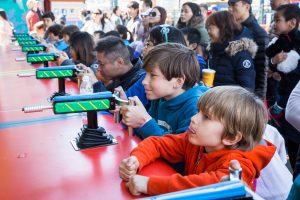 Kids playing amusement games on Coney Island opening day 2017