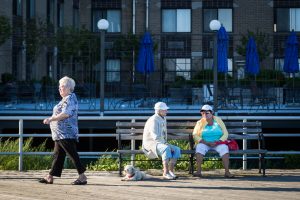 Coney Island street photography of three older women on the boardwalk