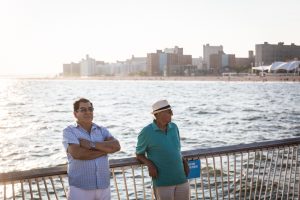 Coney Island street photography of two men on the pier