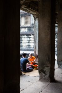 Monks giving a blessing for an Angkor Wat temple guide