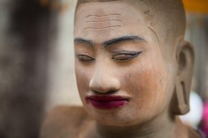 Sculpture with makeup for an Angkor Wat temple guide
