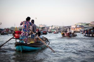 Women driving boats at the Cai Rang Floating Markets