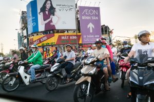 People on motorcycles for article on Ho Chi Minh City street photos