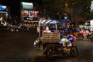 Street vendor at night for article on Ho Chi Minh City street photos
