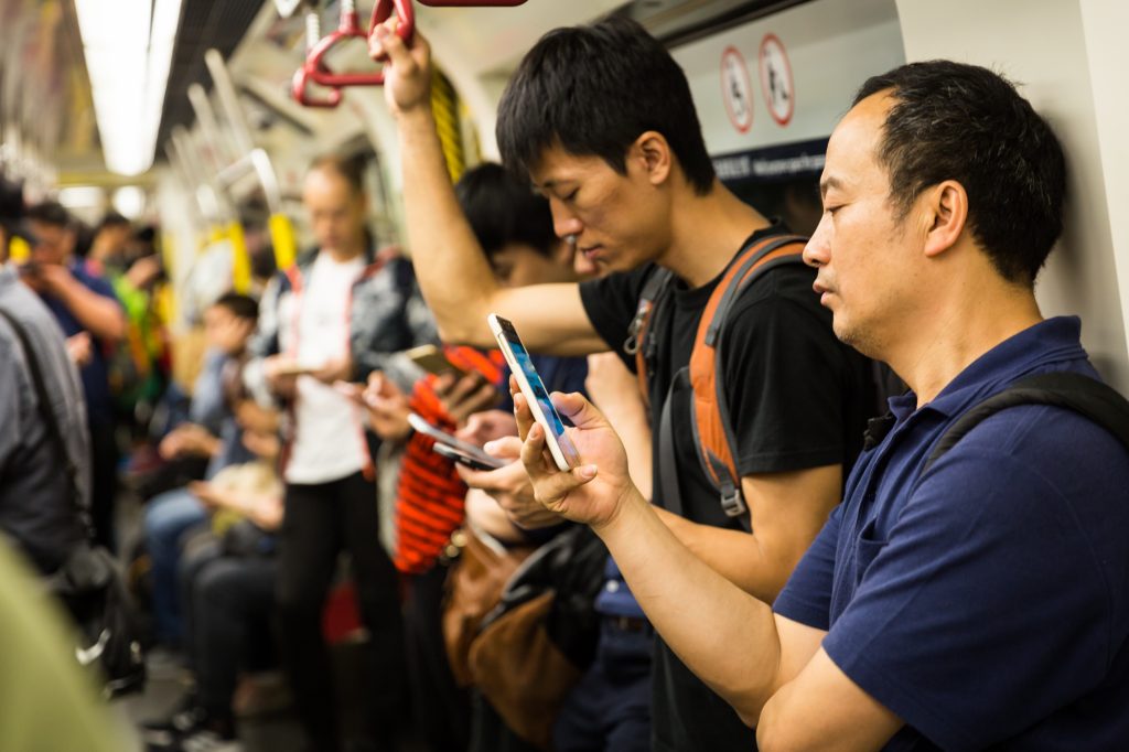 Communters on the MTR subway for a Hong Kong travel guide article