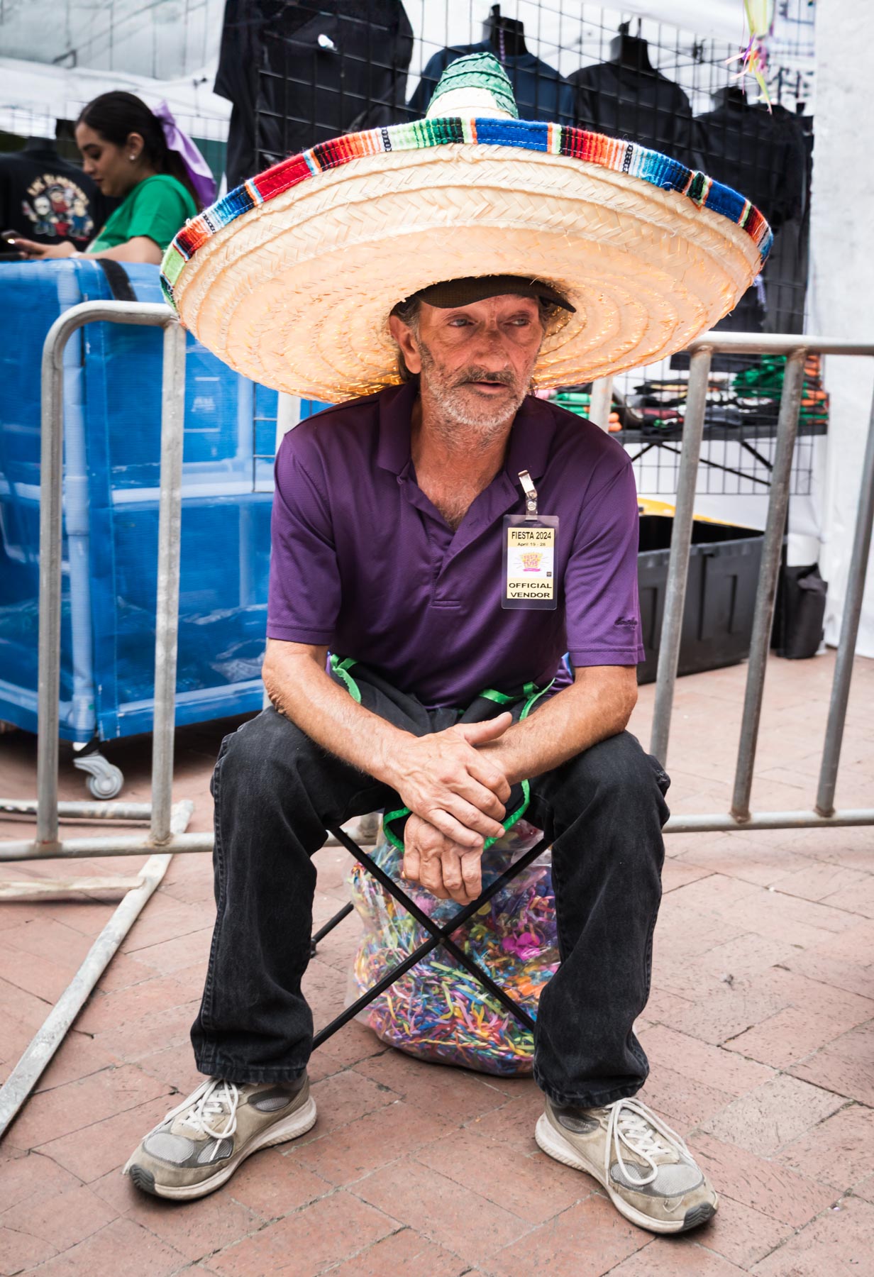 Man sitting wearing purple shirt and large sombrero for an article on the Fiesta photo tips