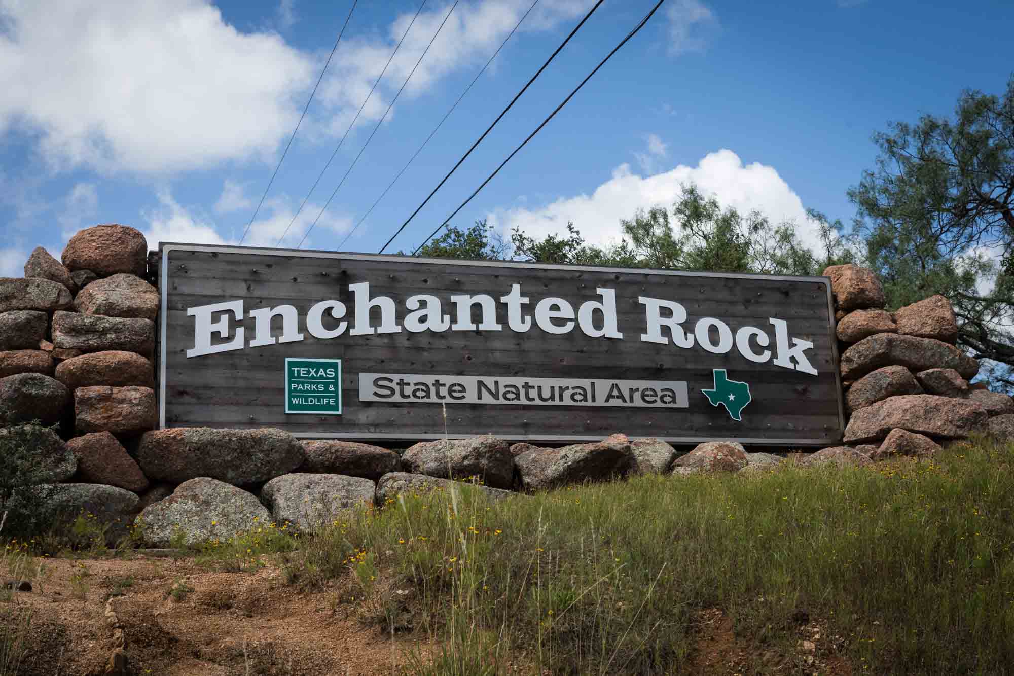 Front sign to Enchanted Rock State Park for an article on Enchanted Rock hiking trips