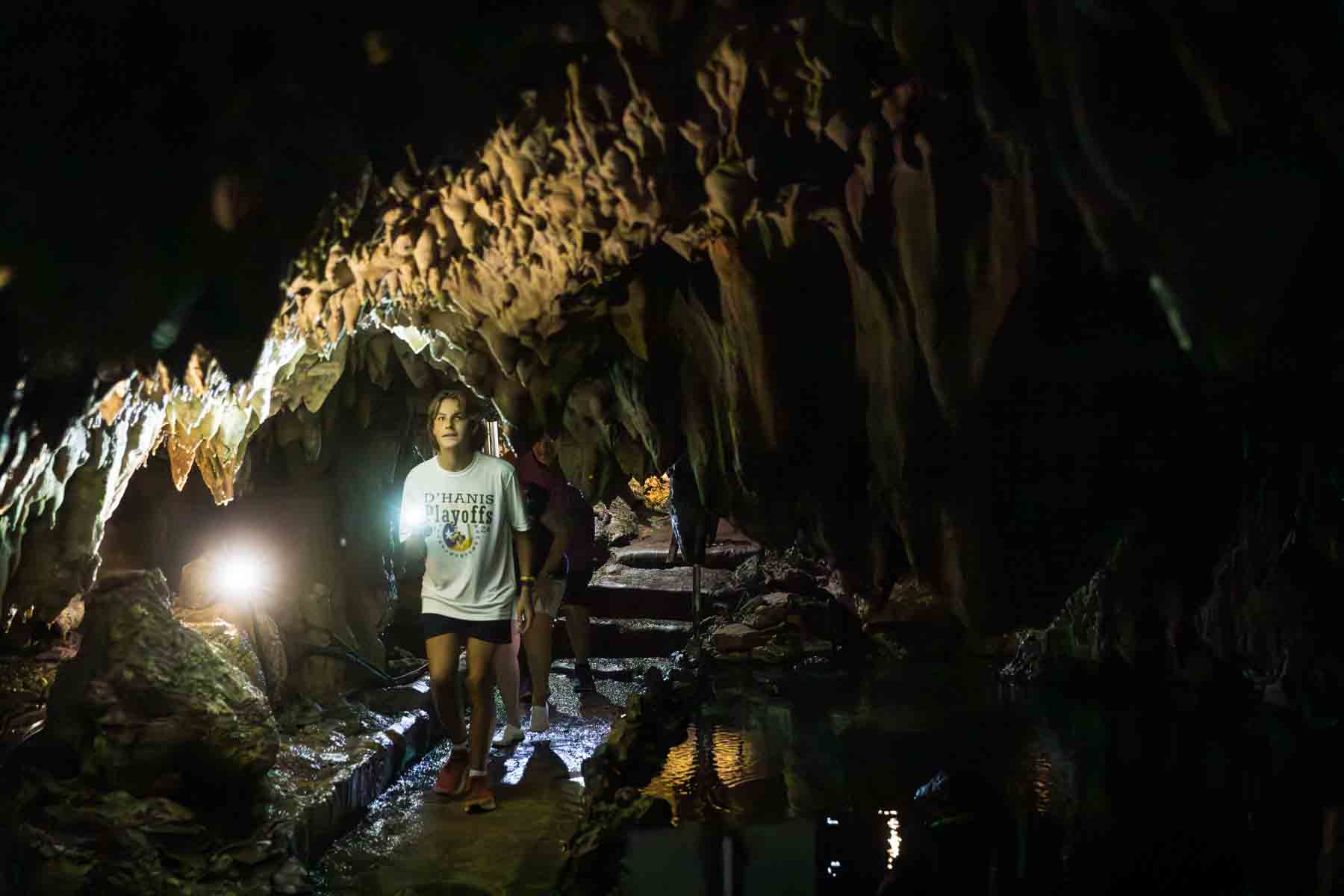 Visitors walking through Cascade Caverns for an article entitled, ‘Visiting Boerne, Texas: Everything You Need to Know’