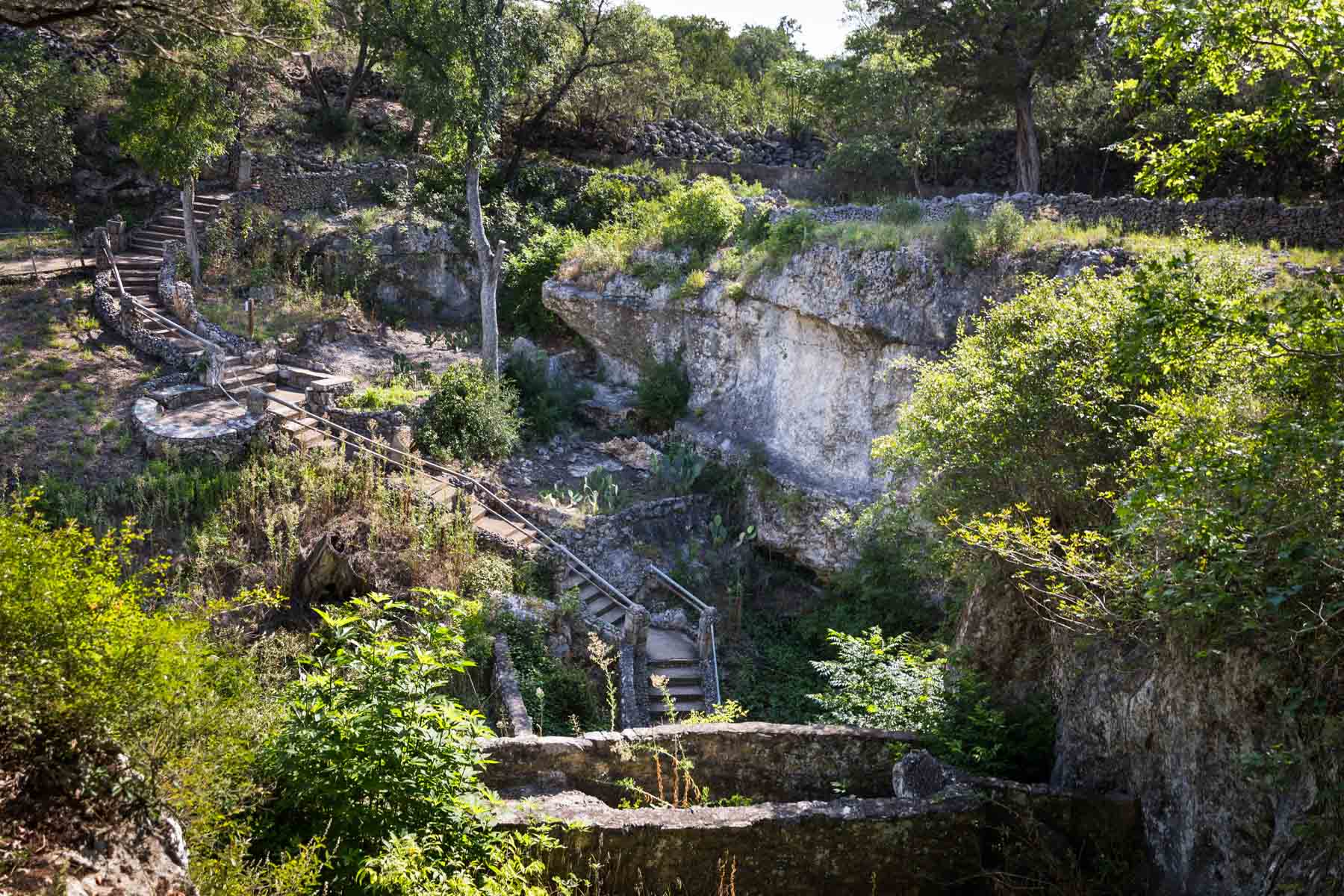 Wide shot of outside entrance to Cascade Caverns for an article entitled, ‘Visiting Boerne, Texas: Everything You Need to Know’