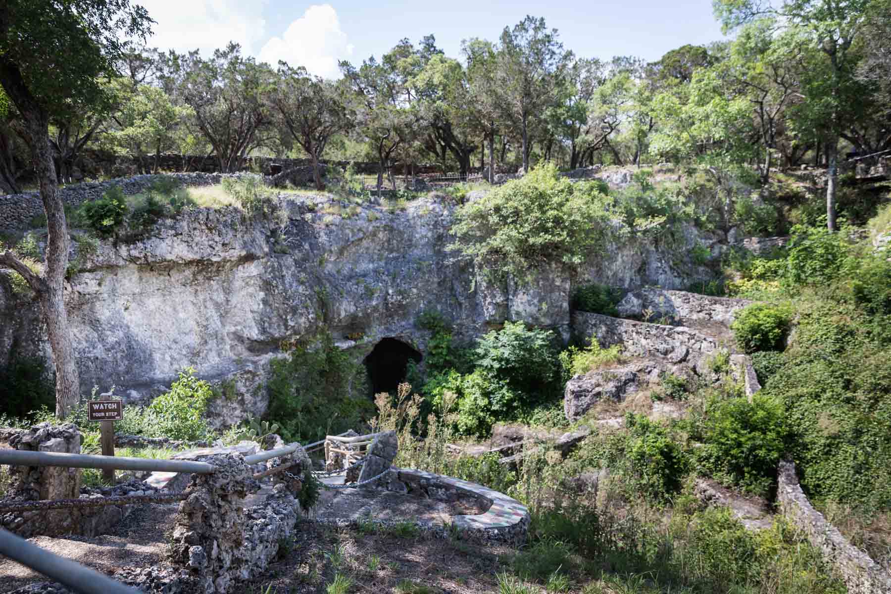 Wide shot of entrance to Cascade Caverns for an article entitled, ‘Visiting Boerne, Texas: Everything You Need to Know’