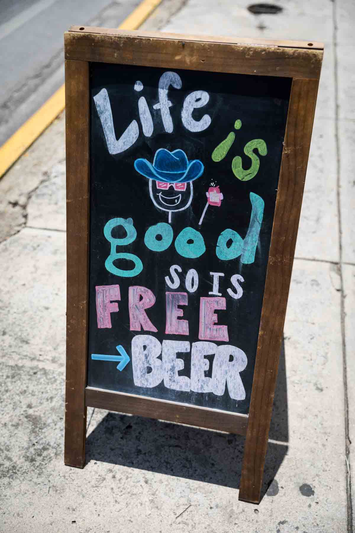 Colorful sign written in chalk on sidewalk for an article entitled, ‘Visiting Boerne, Texas: Everything You Need to Know’