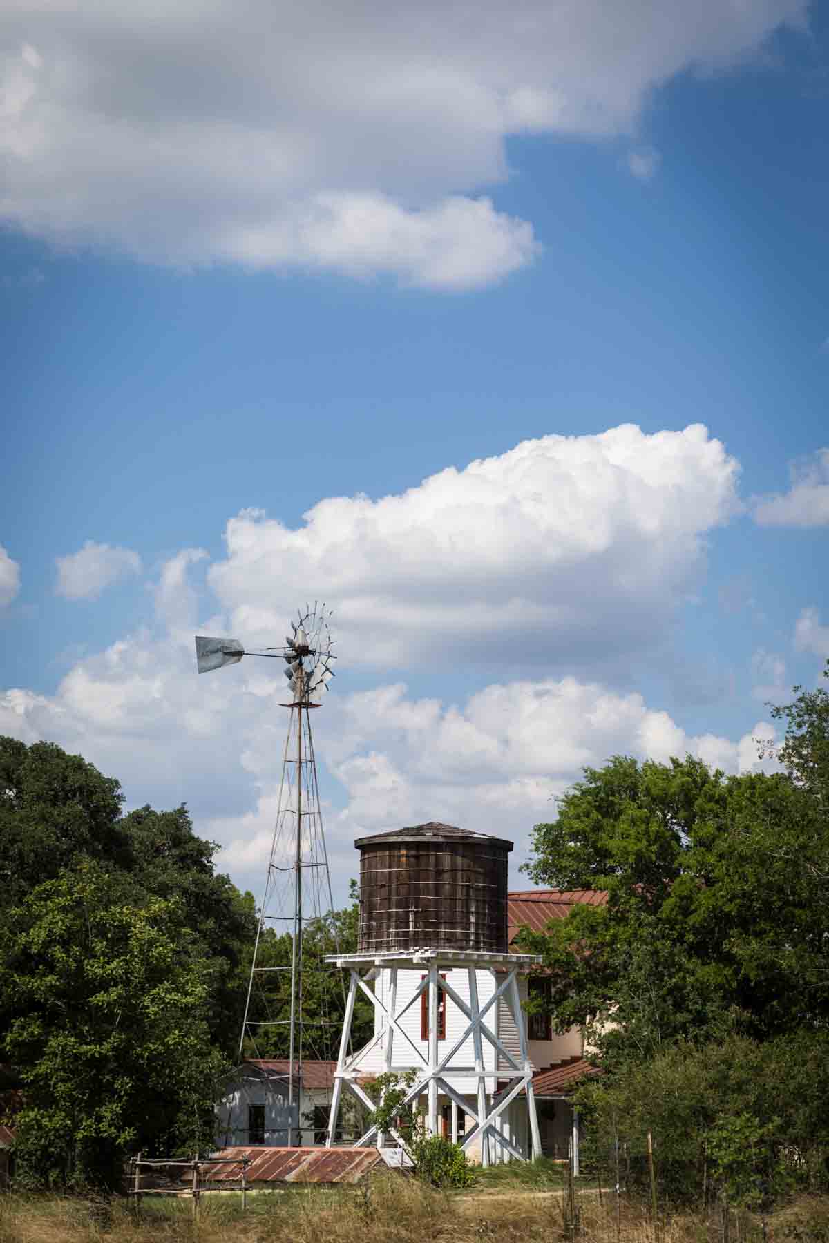 Water tower and windmill on Herff Farm for an article entitled, ‘Visiting Boerne, Texas: Everything You Need to Know’