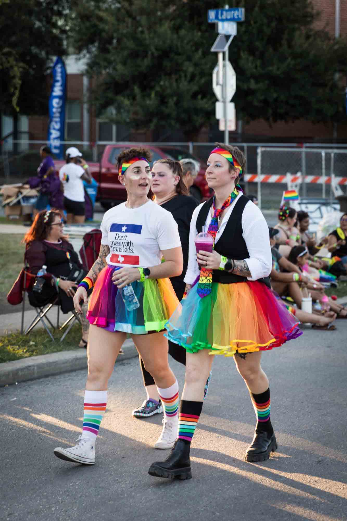 San Antonio gay pride parade photos of two people wearing rainbow skirts