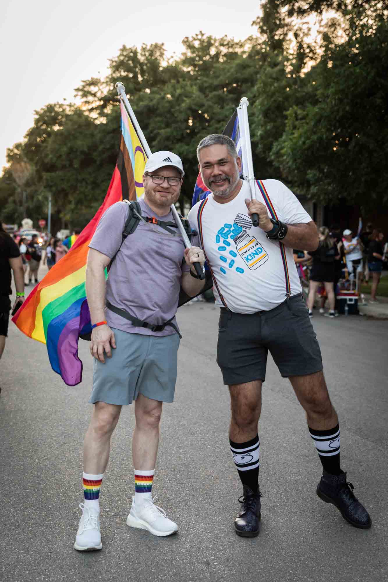 San Antonio gay pride parade photos of two older men carrying gay pride flags