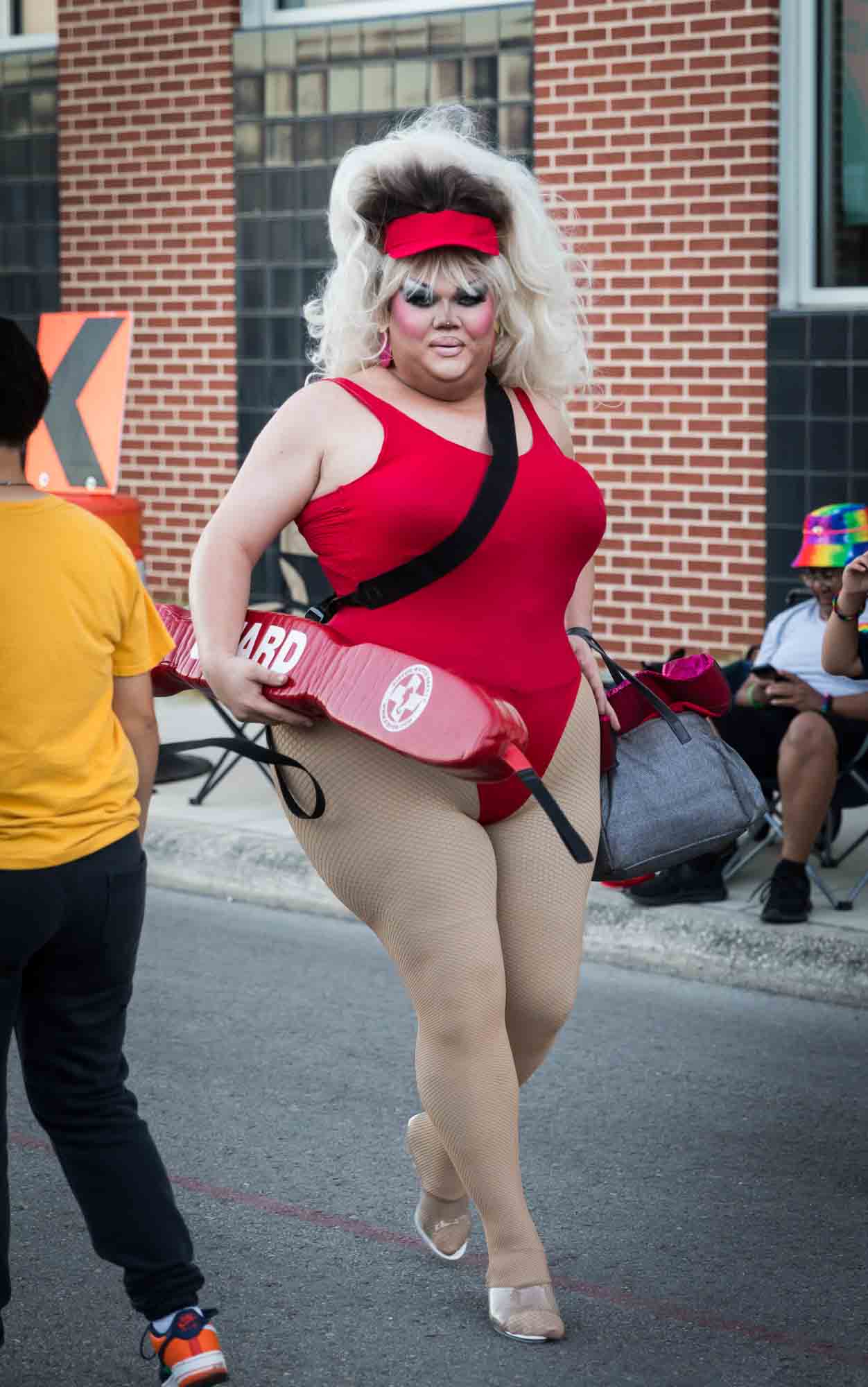 San Antonio gay pride parade photos of drag queen dressed as Pamela Anderson