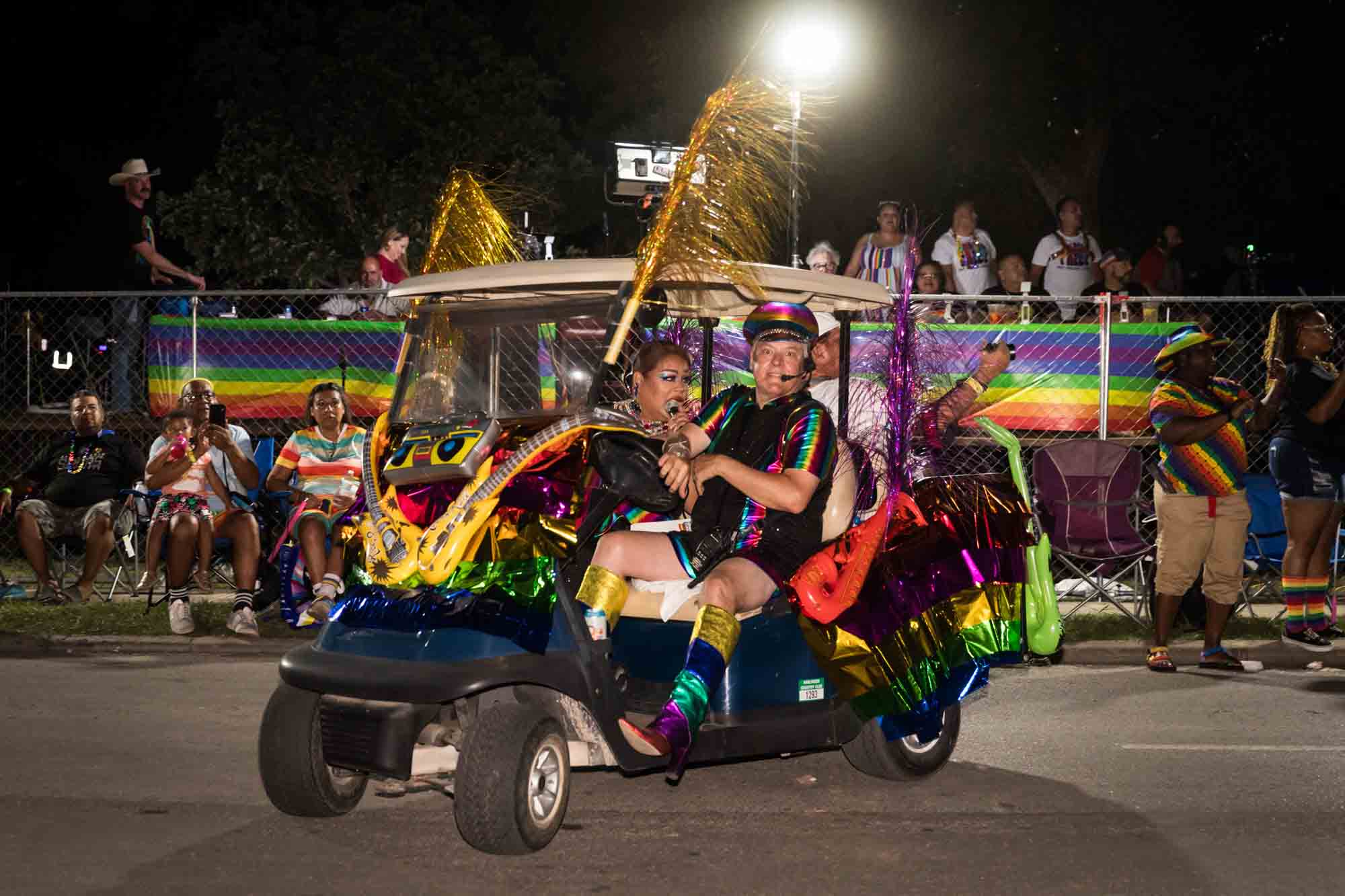 San Antonio gay pride parade photos of emcee arriving on golf cart