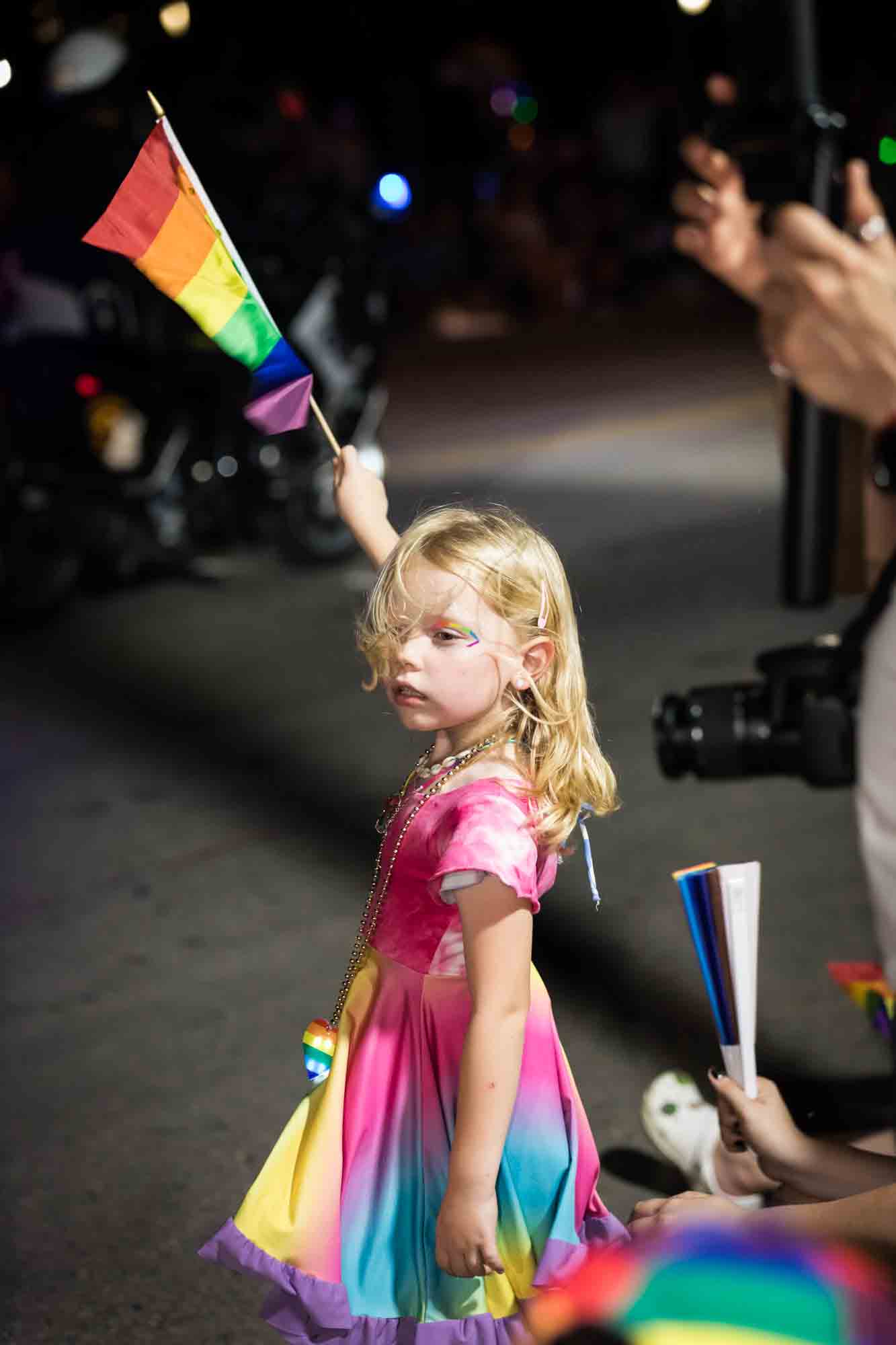 San Antonio gay pride parade photos of blonde girl holding rainbow flag