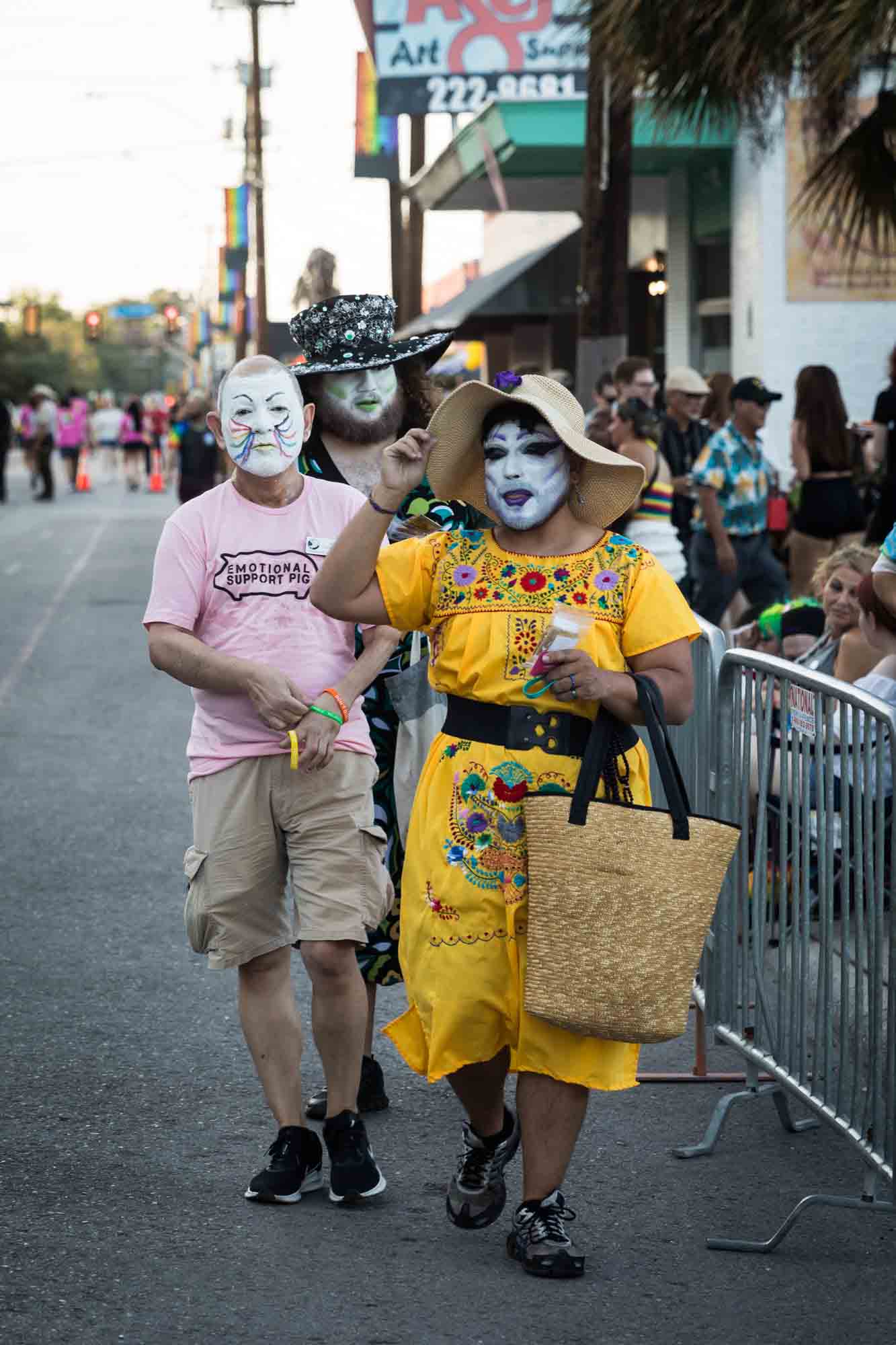 San Antonio gay pride parade photos of three people wearing face masks